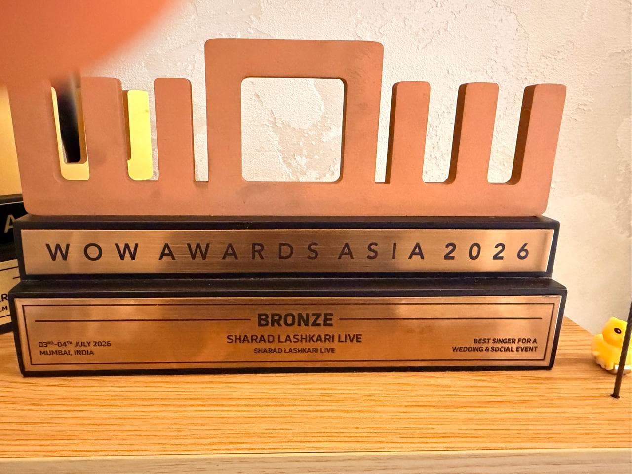 WOW Awards Asia 2026 Bronze trophy awarded to Sharad Lashkari Live for Best Singer for a Wedding and Social Event